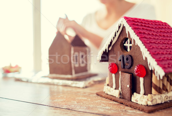 close up of woman making gingerbread houses Stock photo © dolgachov