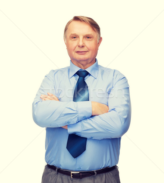 smiling businessman or teacher Stock photo © dolgachov