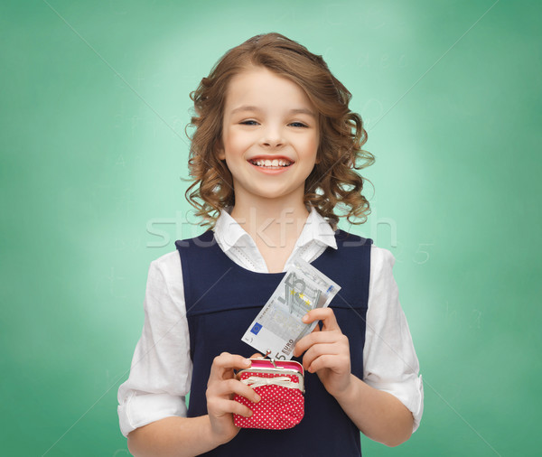 happy girl with purse and paper money Stock photo © dolgachov