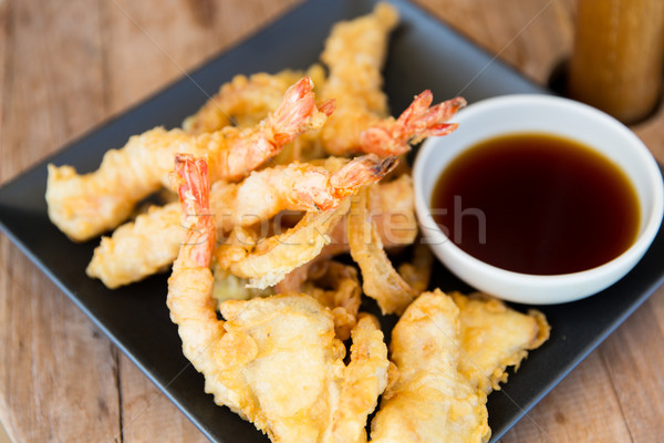 close up of deep-fried shrimps and soy sauce Stock photo © dolgachov