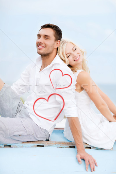 couple sitting on boat at sea side Stock photo © dolgachov