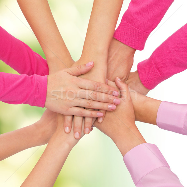 close up of women with hands on top Stock photo © dolgachov