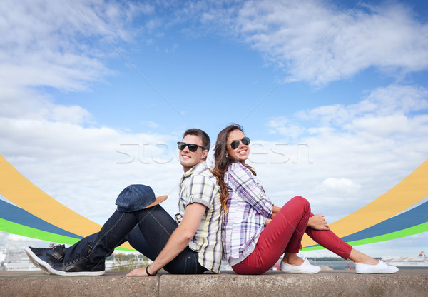 teenagers sitting back to back Stock photo © dolgachov