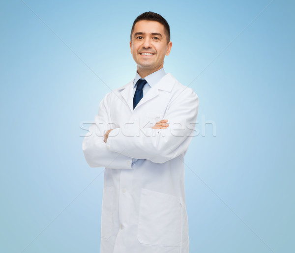 smiling male doctor in white coat Stock photo © dolgachov