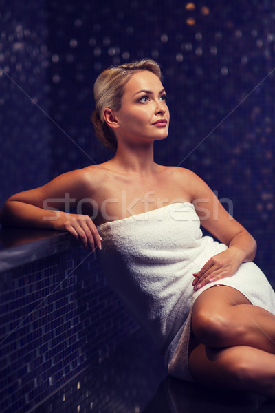 beautiful young woman sitting in bath towel Stock photo © dolgachov