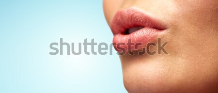close up of young woman lips Stock photo © dolgachov