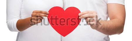 close up of male gay couple hands showing heart Stock photo © dolgachov