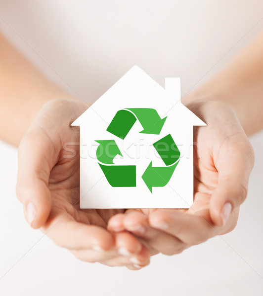 hands holding house with green recycling sign Stock photo © dolgachov