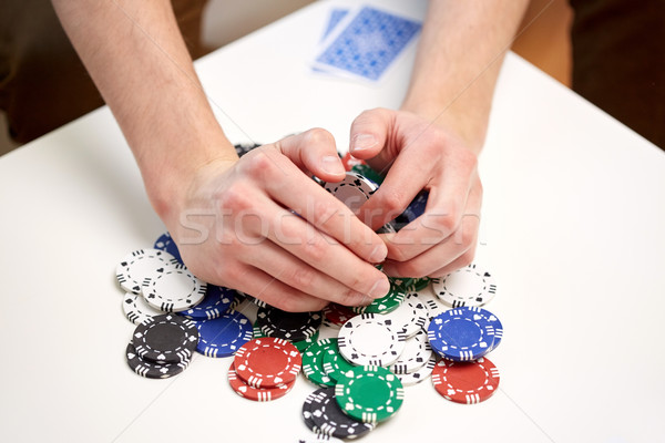 hands with casino chips making bet or taking win Stock photo © dolgachov