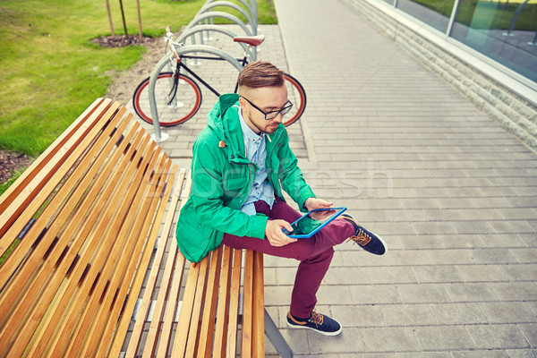 Stock photo: happy young hipster man with tablet pc and bike