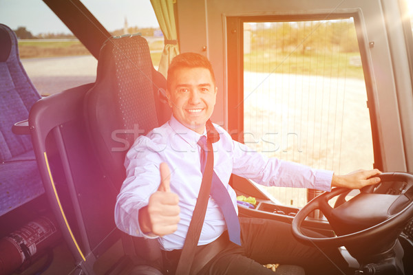 happy driver driving bus and snowing thumbs up Stock photo © dolgachov