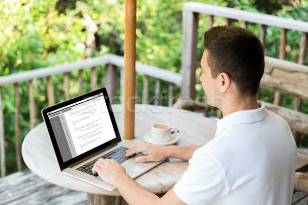 close up of businessman with laptop on terrace Stock photo © dolgachov
