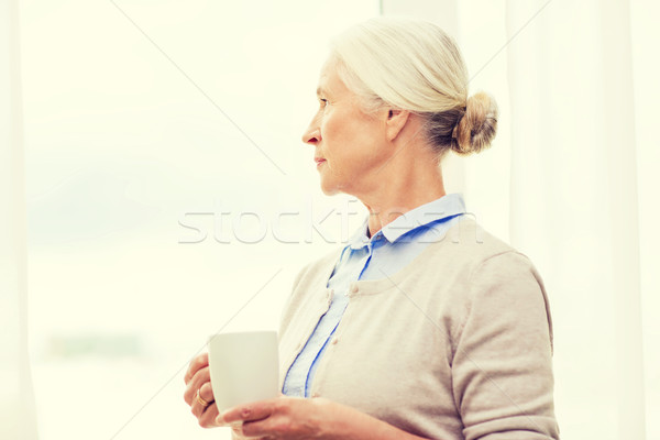 Yalnız kıdemli kadın fincan çay kahve Stok fotoğraf © dolgachov