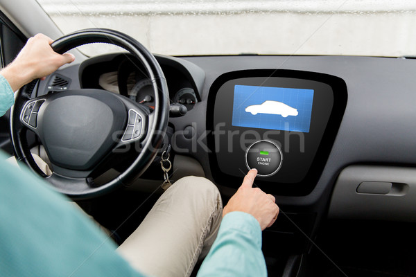 close up of man in car with starter on computer Stock photo © dolgachov