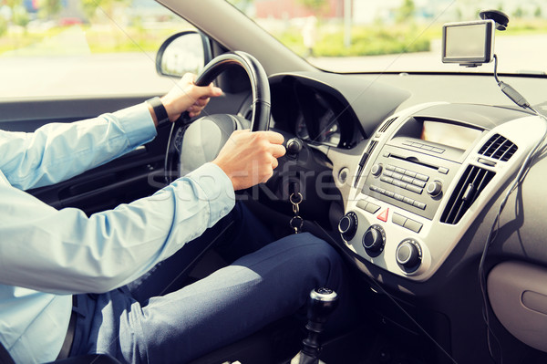 close up of young man driving car Stock photo © dolgachov