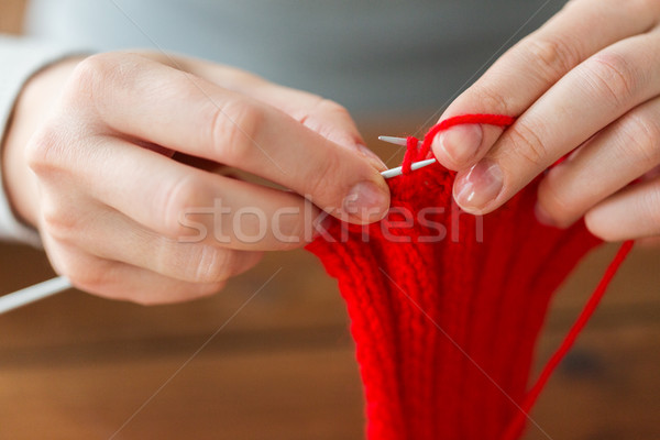 close up of hands knitting with needles and yarn Stock photo © dolgachov
