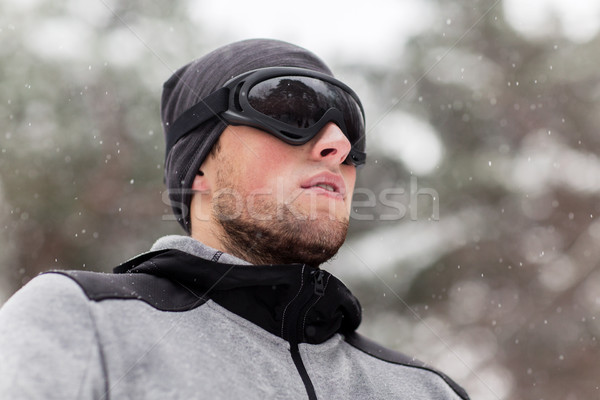 sports man with ski goggles in winter outdoors Stock photo © dolgachov