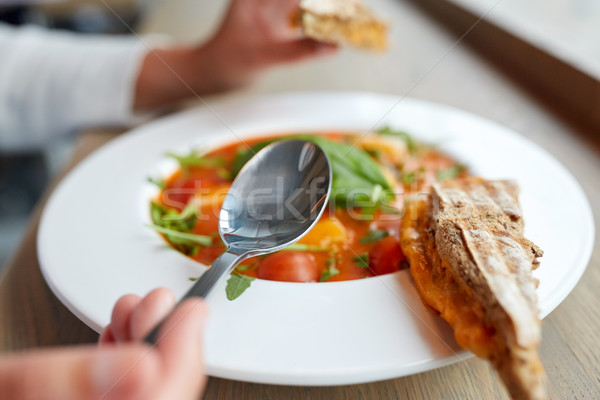 woman eating gazpacho soup at restaurant Stock photo © dolgachov