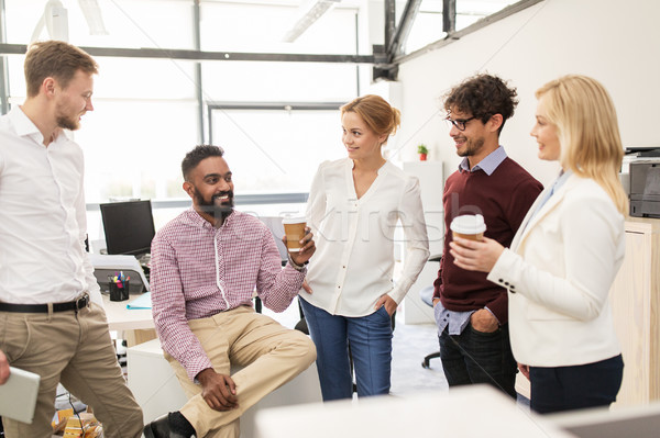 happy business team drinking coffee at office Stock photo © dolgachov