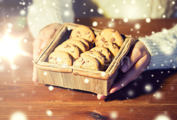 close up of woman with oat cookies at home Stock photo © dolgachov