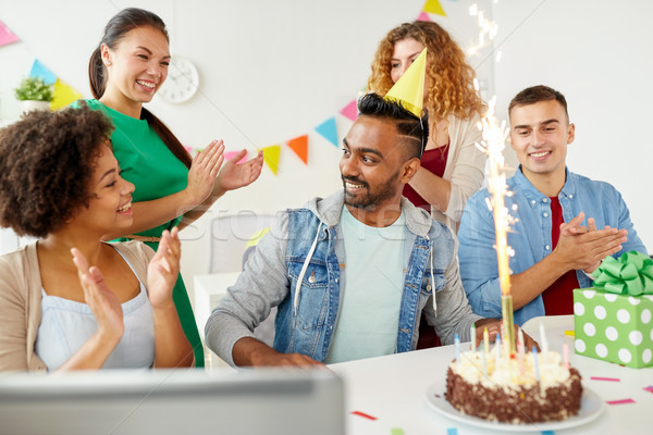 office team greeting colleague at birthday party Stock photo © dolgachov