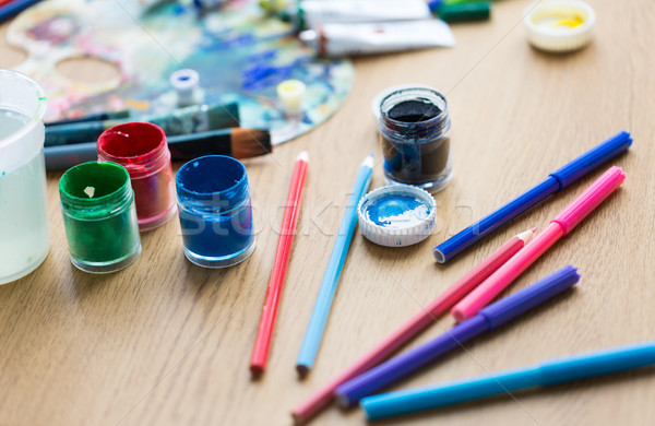 gouache colors, felt tip pens and pencils on table Stock photo © dolgachov