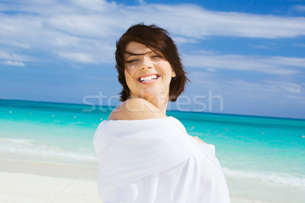 happy woman with white sarong Stock photo © dolgachov
