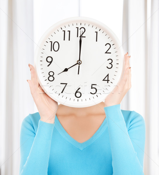 businesswoman with clock over her face Stock photo © dolgachov