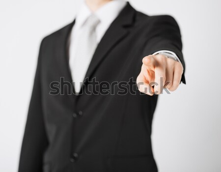 Stock photo: man pointing his finger at you