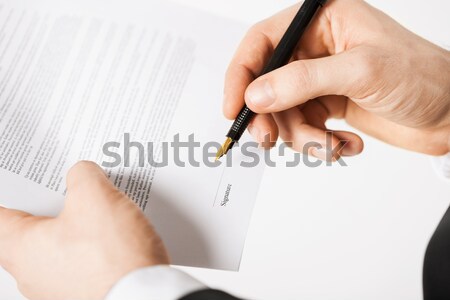 man with contract Stock photo © dolgachov