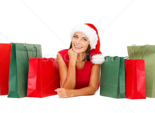 woman in red shirt with shopping bags Stock photo © dolgachov