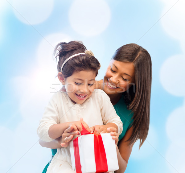 happy mother and child girl with gift box Stock photo © dolgachov