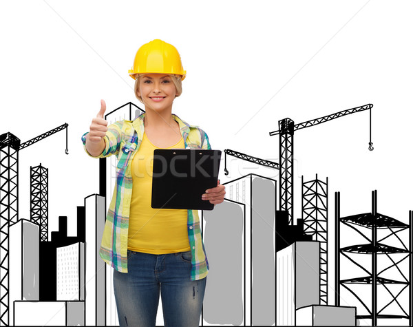 Uśmiechnięta kobieta kask schowek naprawy budowy utrzymanie Zdjęcia stock © dolgachov