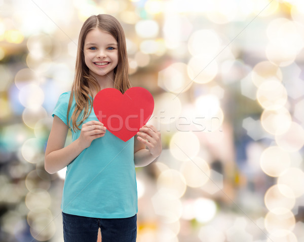 Sorridente little girl vermelho coração amor felicidade Foto stock © dolgachov