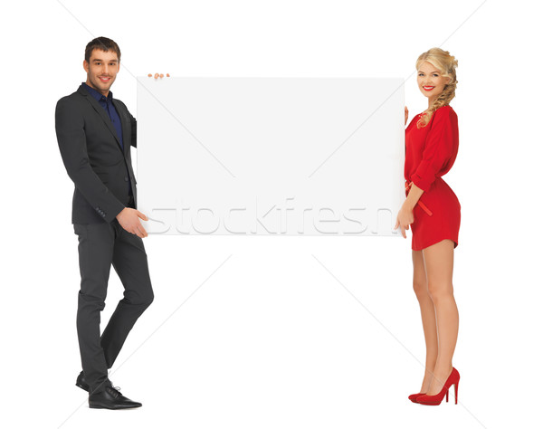 couple holding big blank white board Stock photo © dolgachov