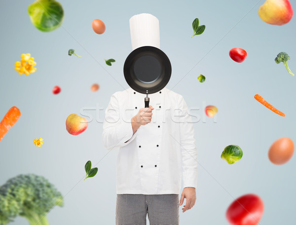 Männlich Küchenchef Koch Gesicht Pfanne Kochen Stock foto © dolgachov