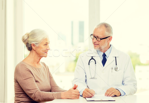 Souriant supérieurs femme médecin réunion médecine [[stock_photo]] © dolgachov