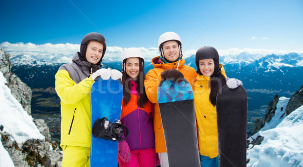 happy friends in helmets with snowboards outdoors Stock photo © dolgachov