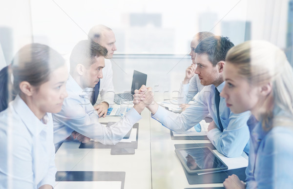 smiling business people having conflict in office Stock photo © dolgachov