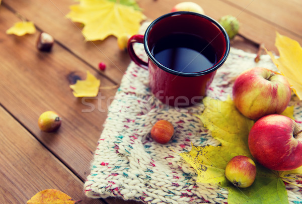 close up of tea cup on table with autumn leaves Stock photo © dolgachov