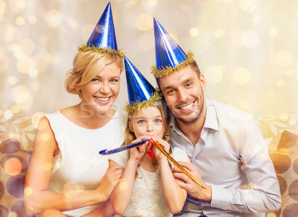 Lächelnd Familie blau Hüte begünstigen Stock foto © dolgachov