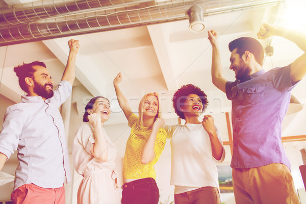 happy creative team in office Stock photo © dolgachov