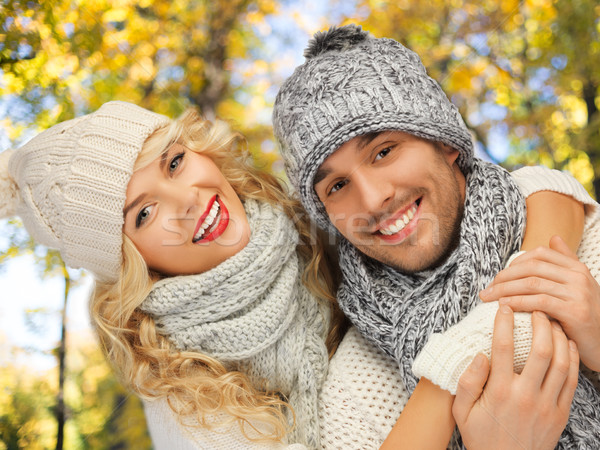 happy couple in warm clothes over autumn Stock photo © dolgachov