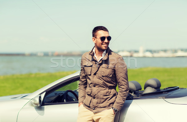 happy man near cabriolet car outdoors Stock photo © dolgachov