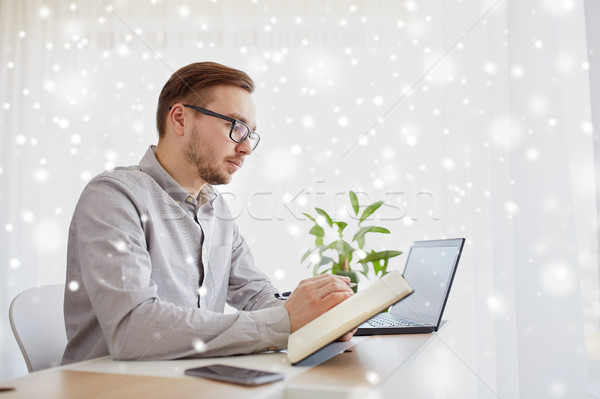 creative man or businessman writing to notebook Stock photo © dolgachov