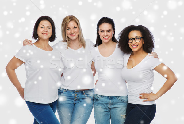 group of happy different women in white t-shirts Stock photo © dolgachov