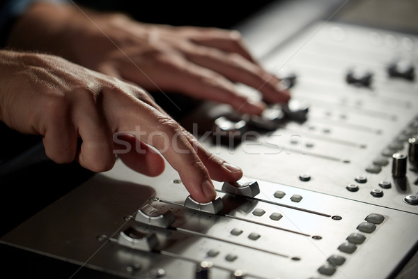 hands on mixing console in music recording studio Stock photo © dolgachov