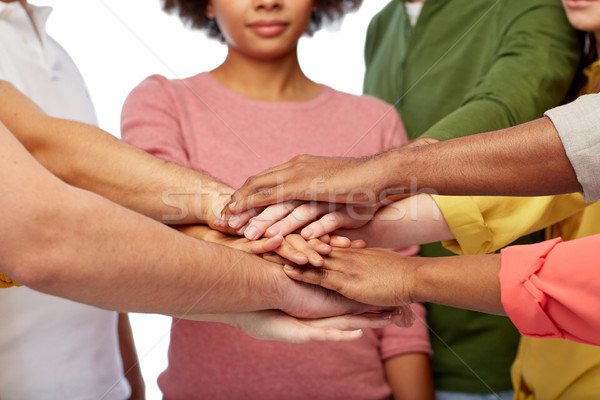 group of international people with hands together Stock photo © dolgachov