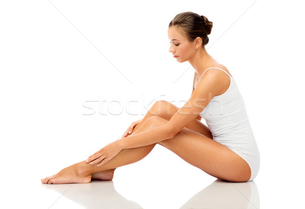 beautiful woman touching her smooth bare legs Stock photo © dolgachov