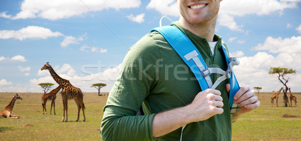 close up of happy man with backpack traveling Stock photo © dolgachov
